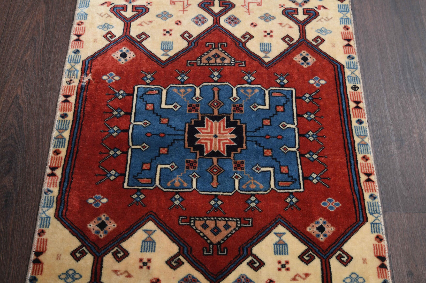 Tuncnihal runner: 1970s handmade Anatolian runner with oriental motifs and cotton backing