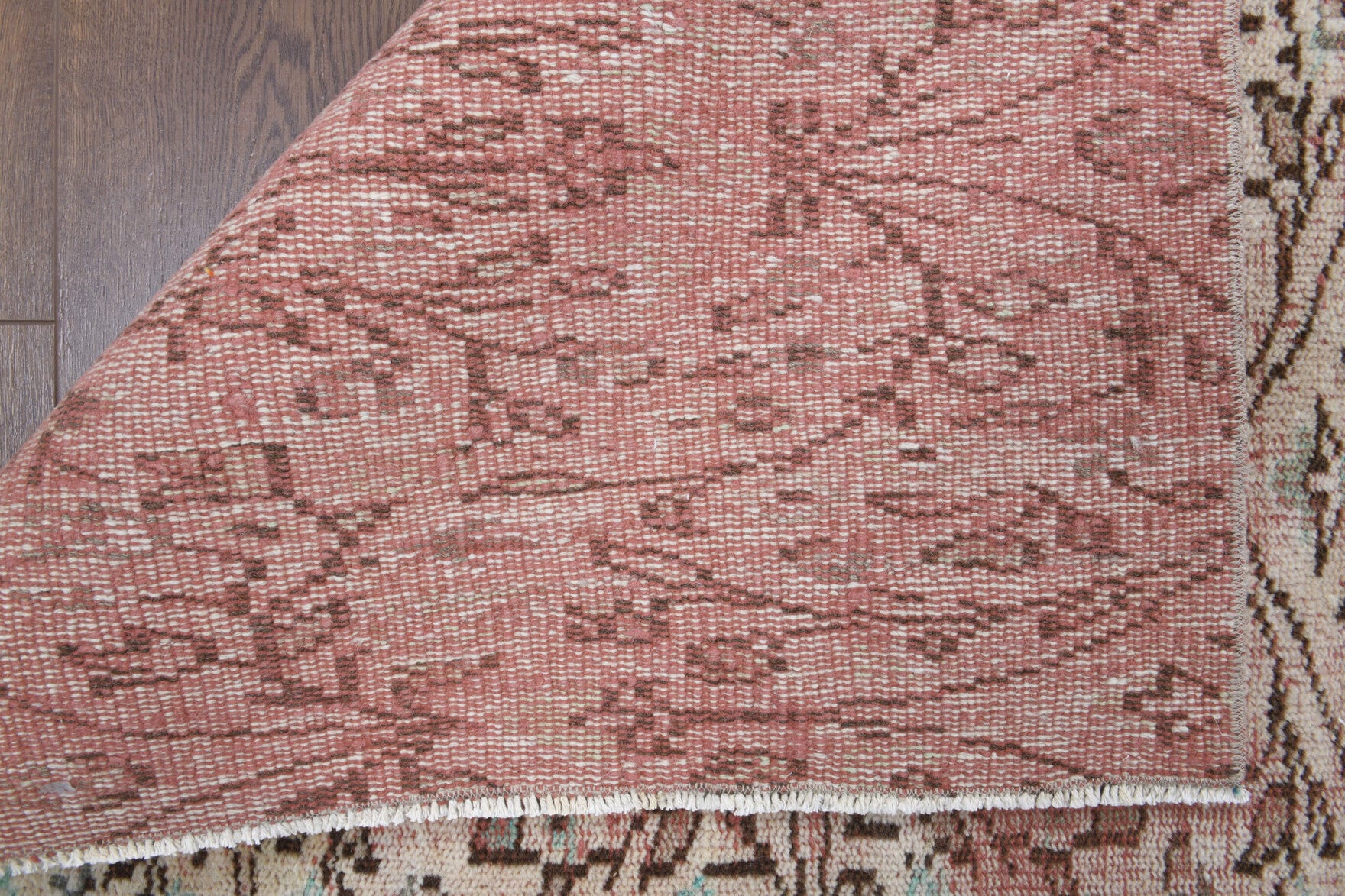 Theopeia rug: 1970s handmade Anatolian rug with floral motifs and cotton backing