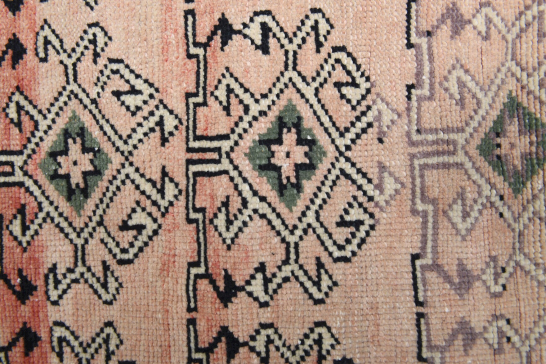 Suzanruh rug: 1970s handmade Anatolian rug with ikat motifs and cotton backing