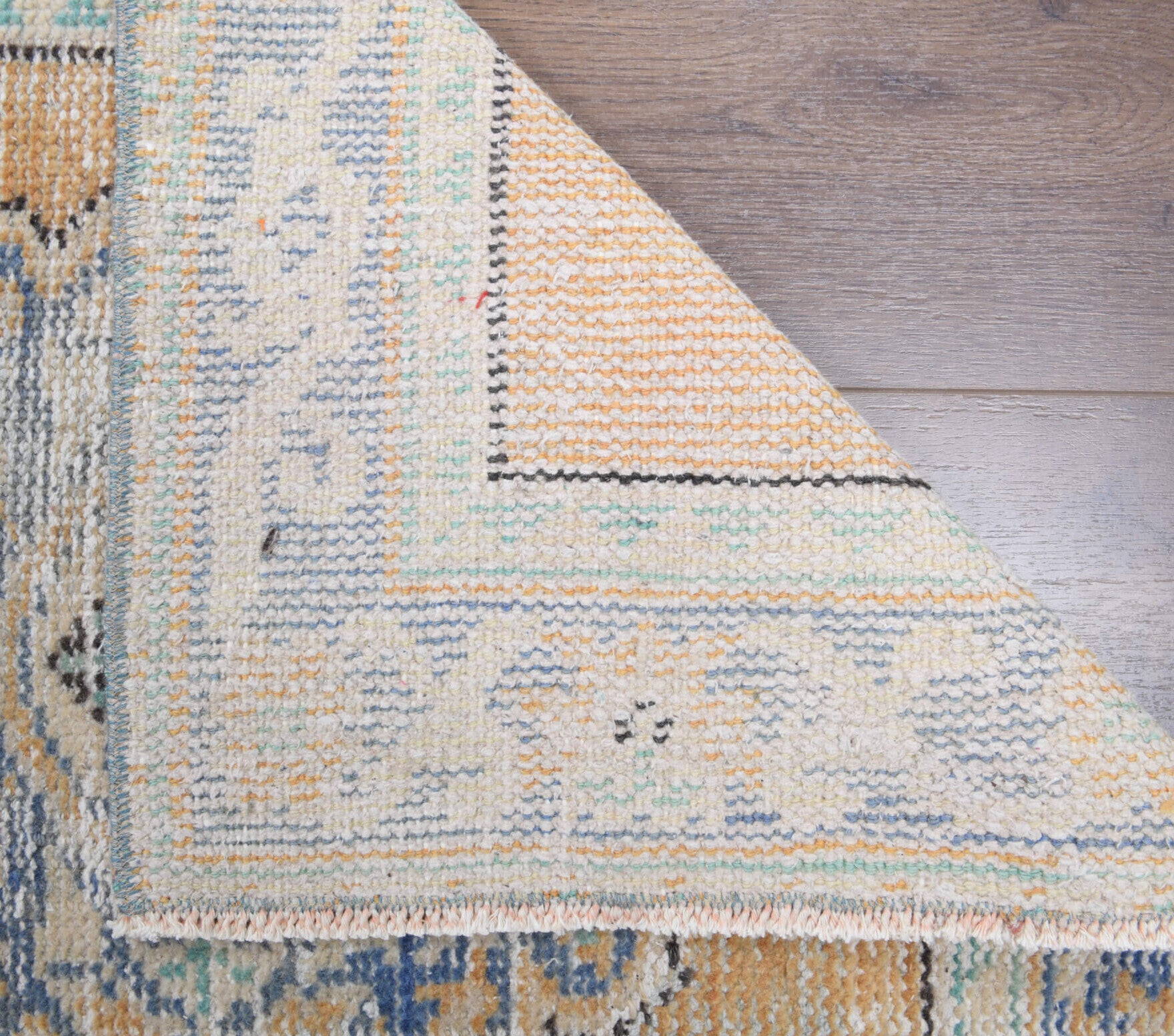 Mzia runner: 1970s handmade Anatolian runner with oriental motifs and cotton backing
