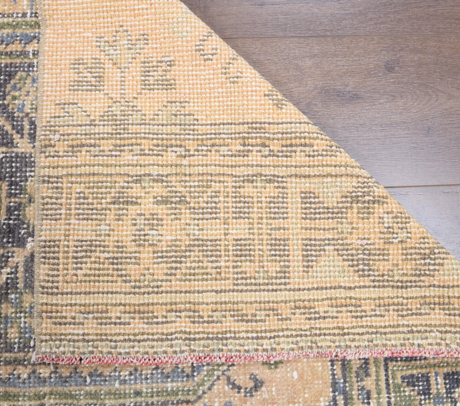 Ketengonca runner: 1970s handmade Anatolian runner with floral motifs and cotton backing