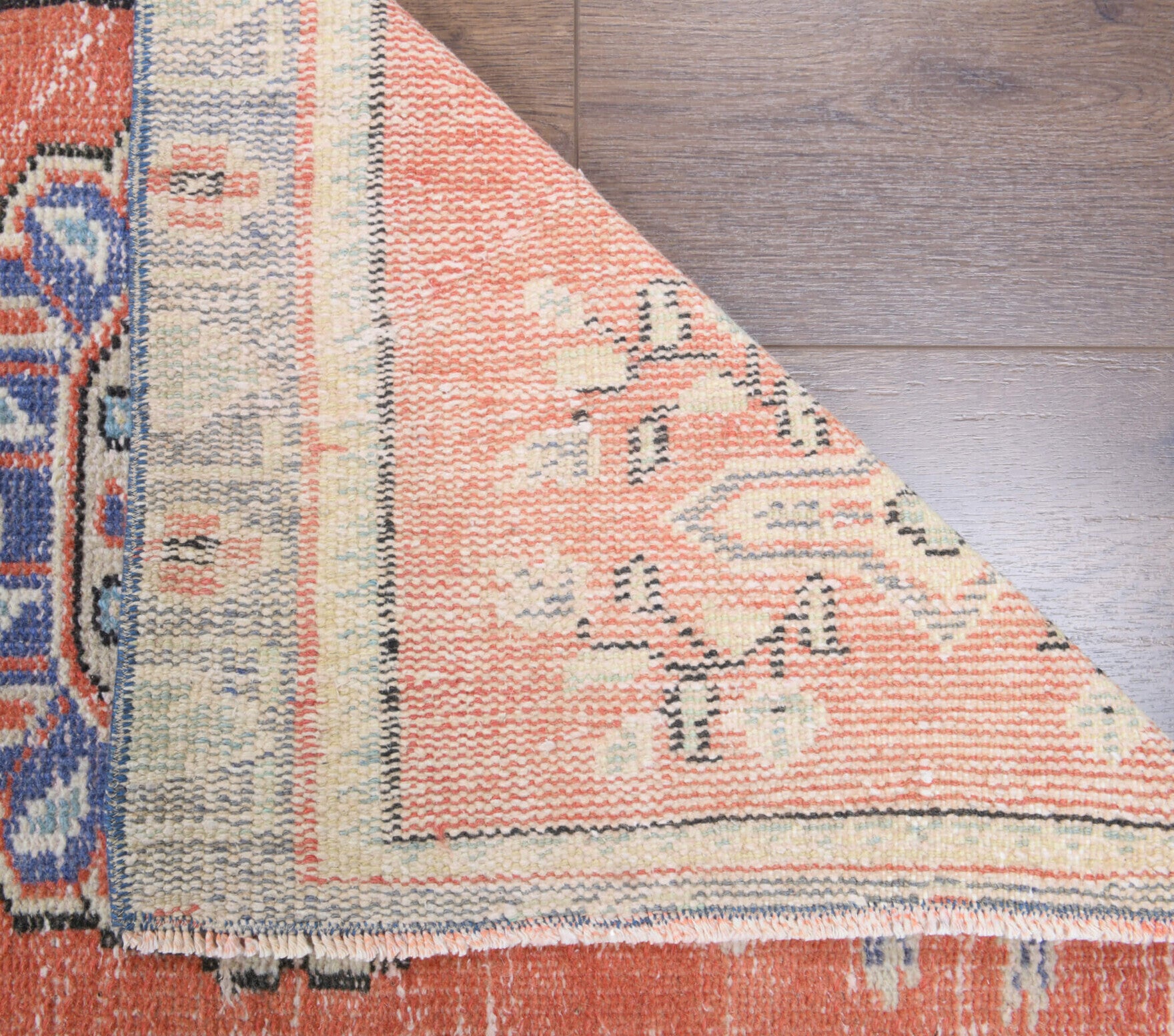 Kelebeknihal runner: 1970s handmade Anatolian runner with oriental motifs and cotton backing