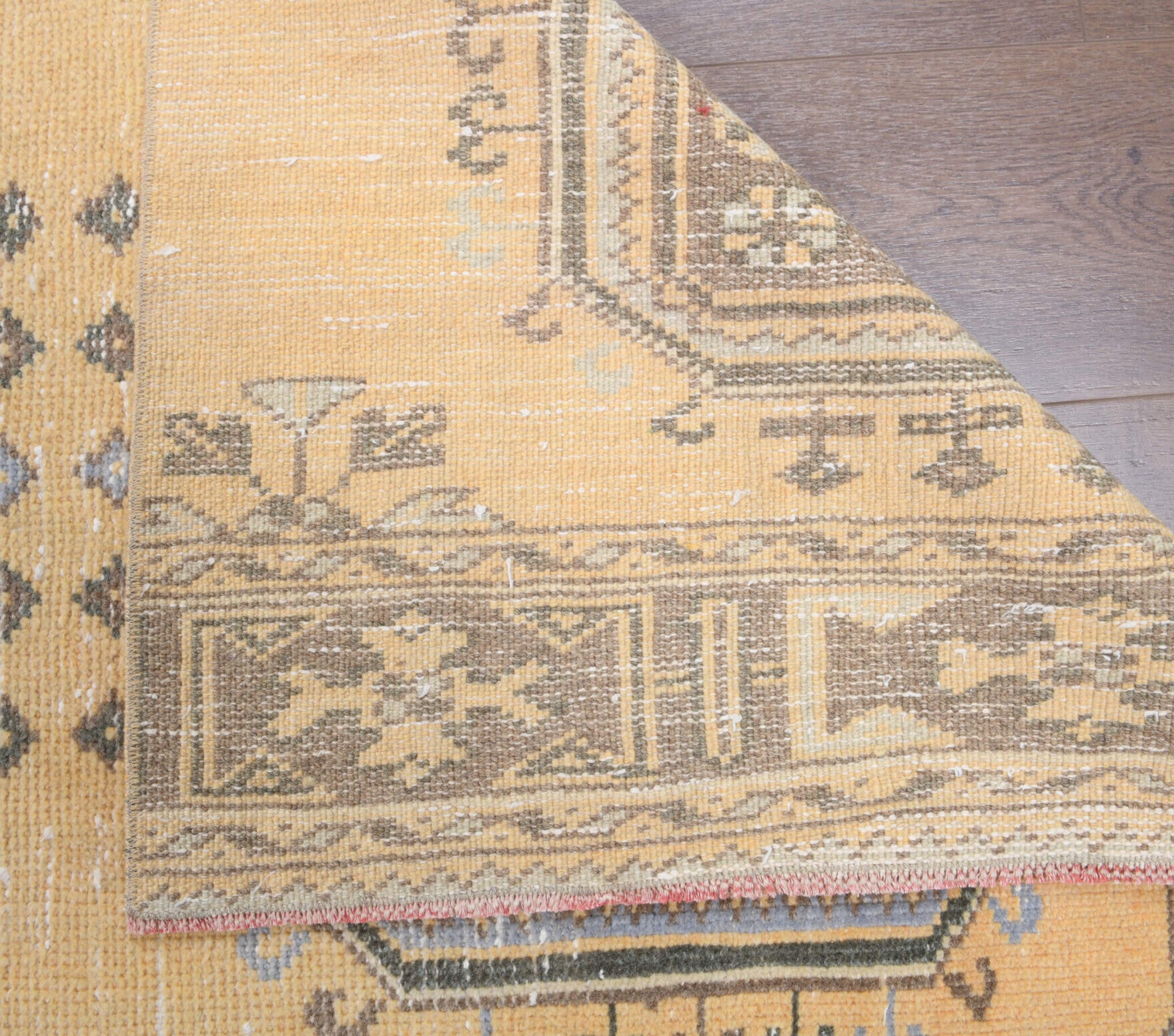 Kalotheia runner: 1970s handmade Anatolian runner with floral motifs and cotton backing