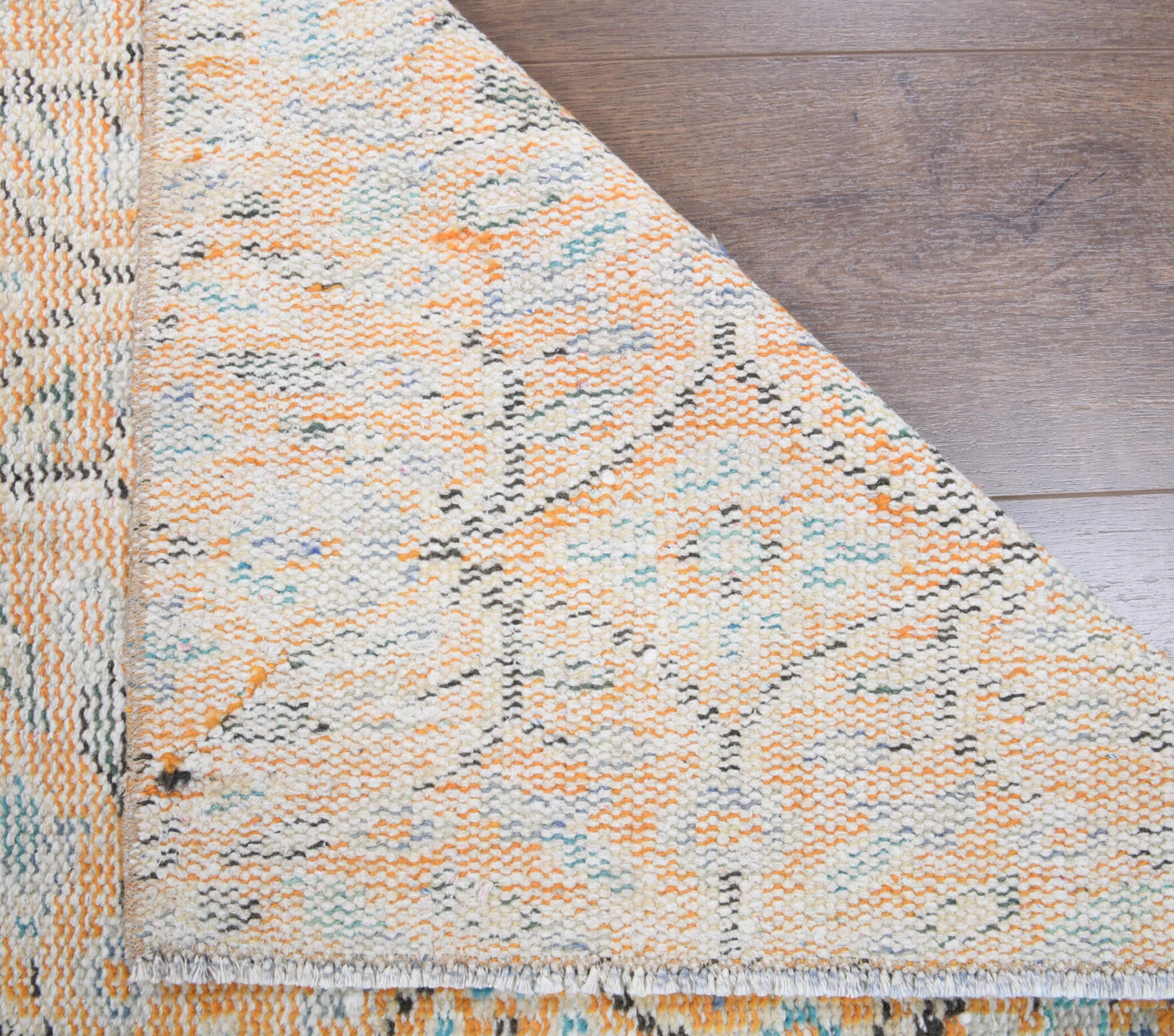 Ilginbahce runner: 1970s handmade Anatolian runner with floral motifs and cotton backing