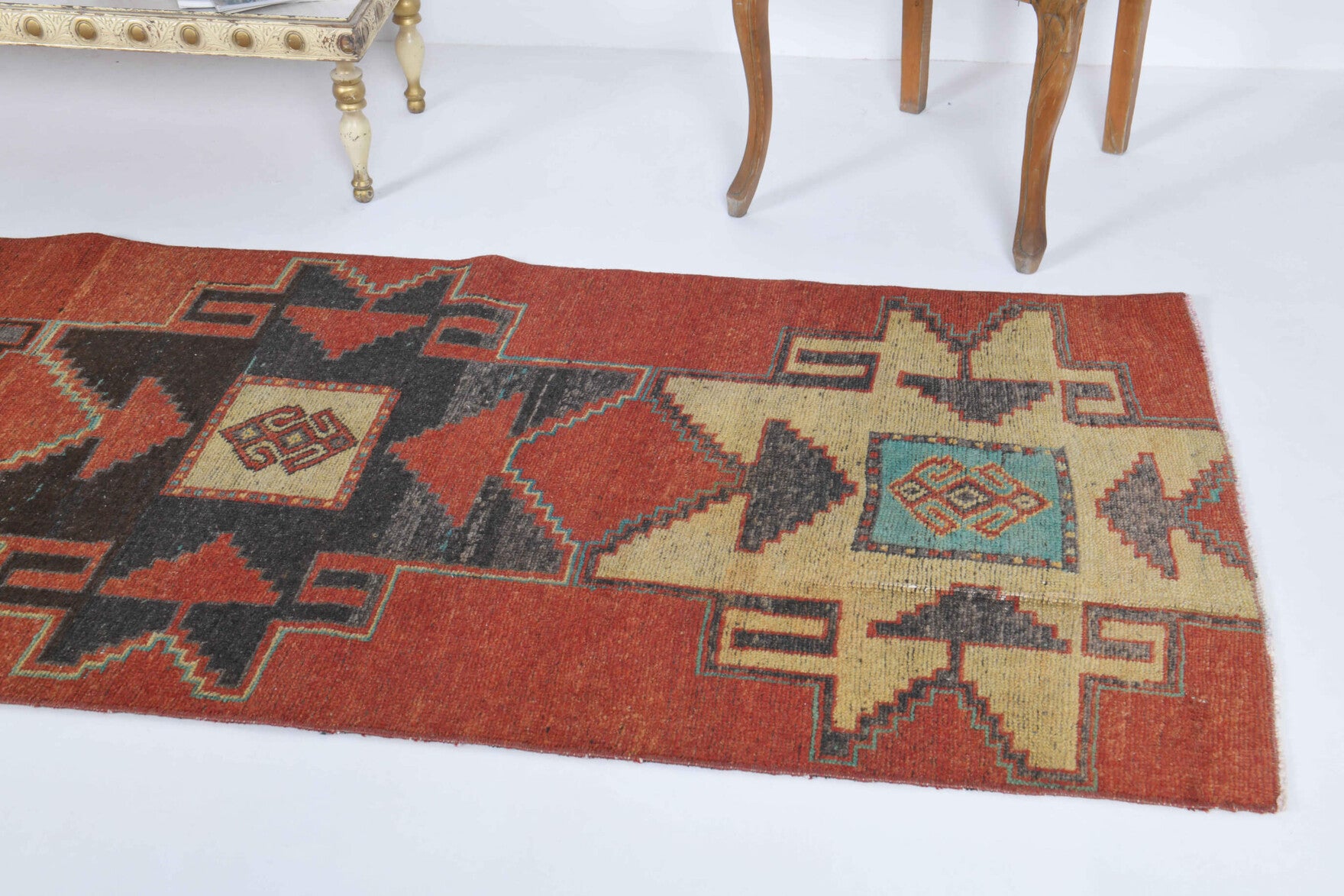 Guldemnaz runner: 1970s handmade Anatolian runner with tribal motifs and cotton backing