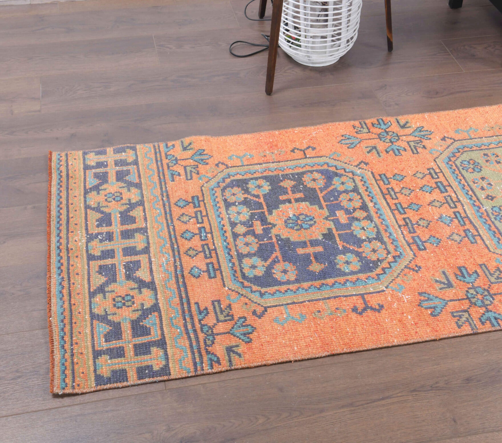 Fulanegul runner: 1970s handmade Anatolian runner with floral motifs and cotton backing