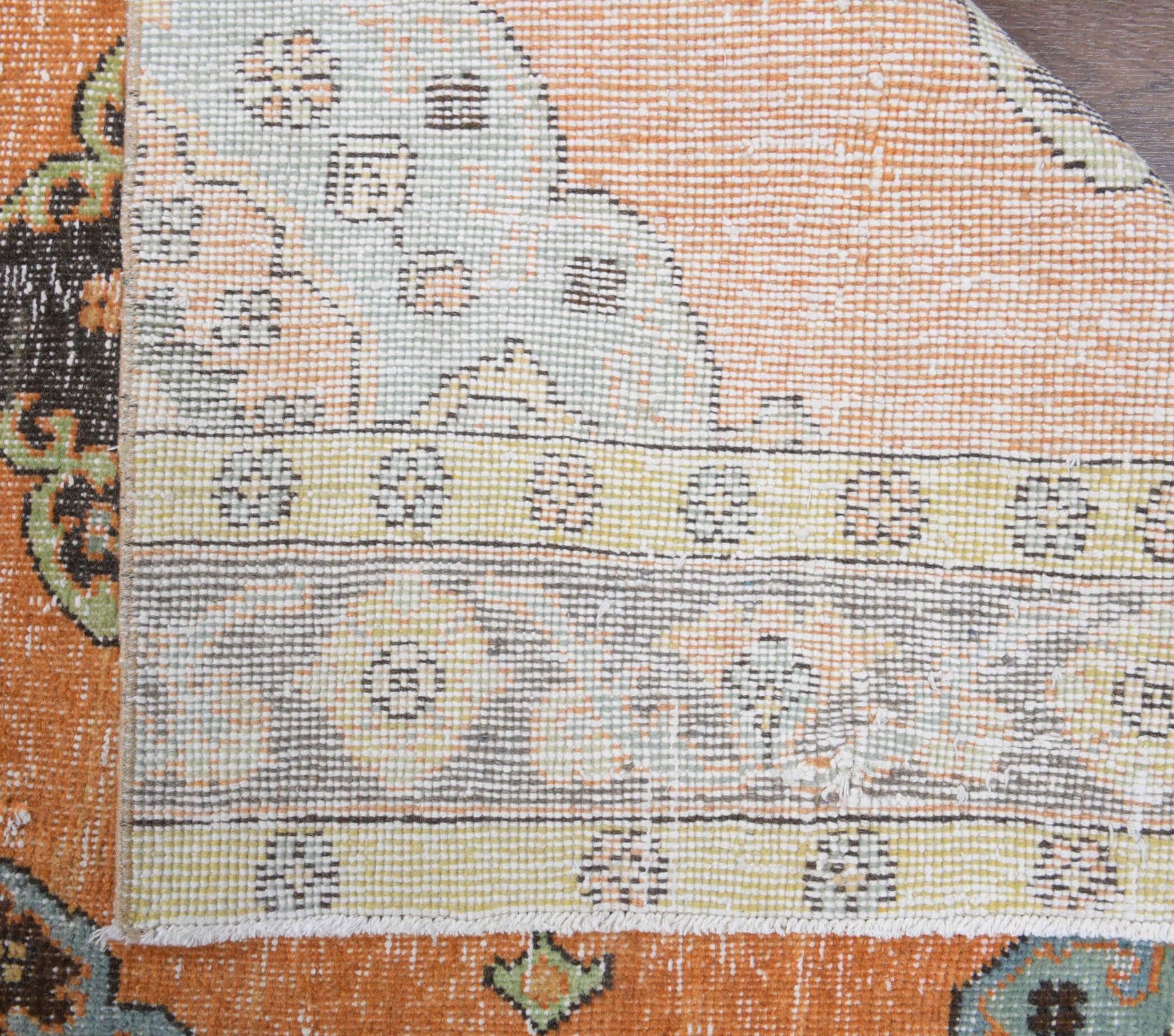 Deniz runner: 1970s handmade Anatolian runner with oriental motifs and cotton backing